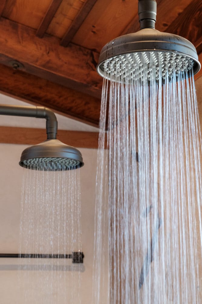 Water flowing from two showerheads